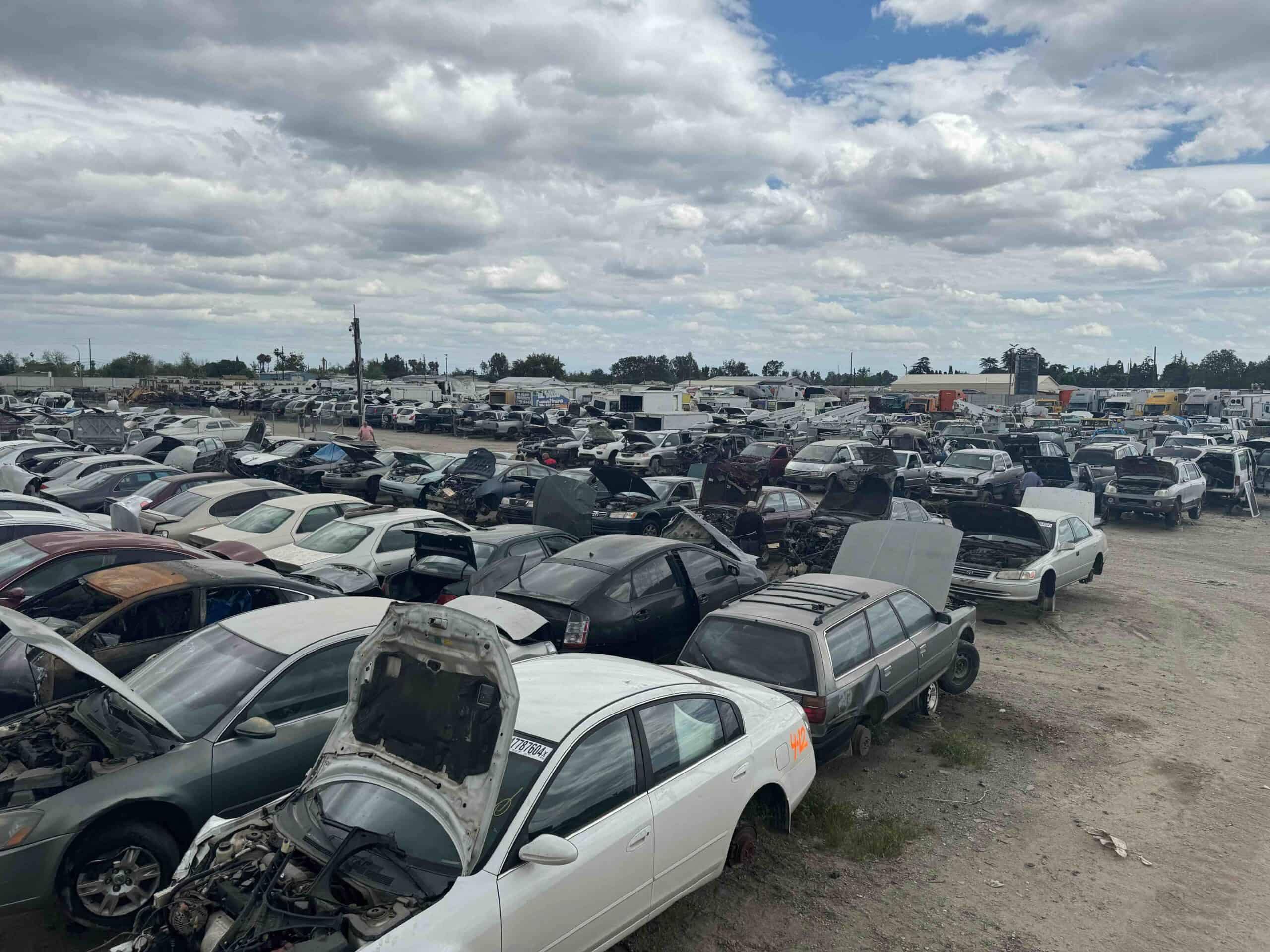Angled view of pick-a-part auto yard at Westside Dismantlers Fresno